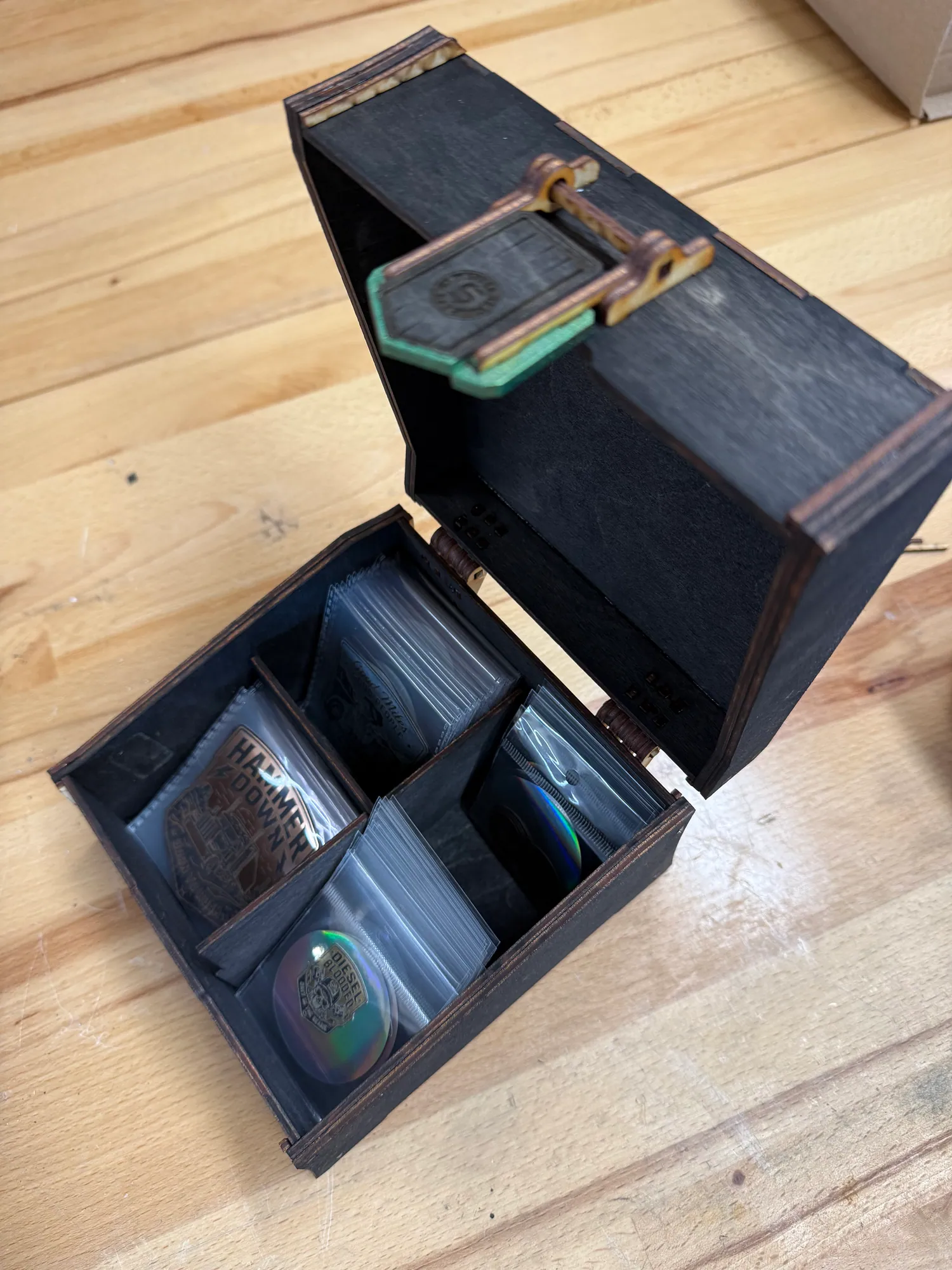 Open State of Stick, Co. retail display box holding emblem products