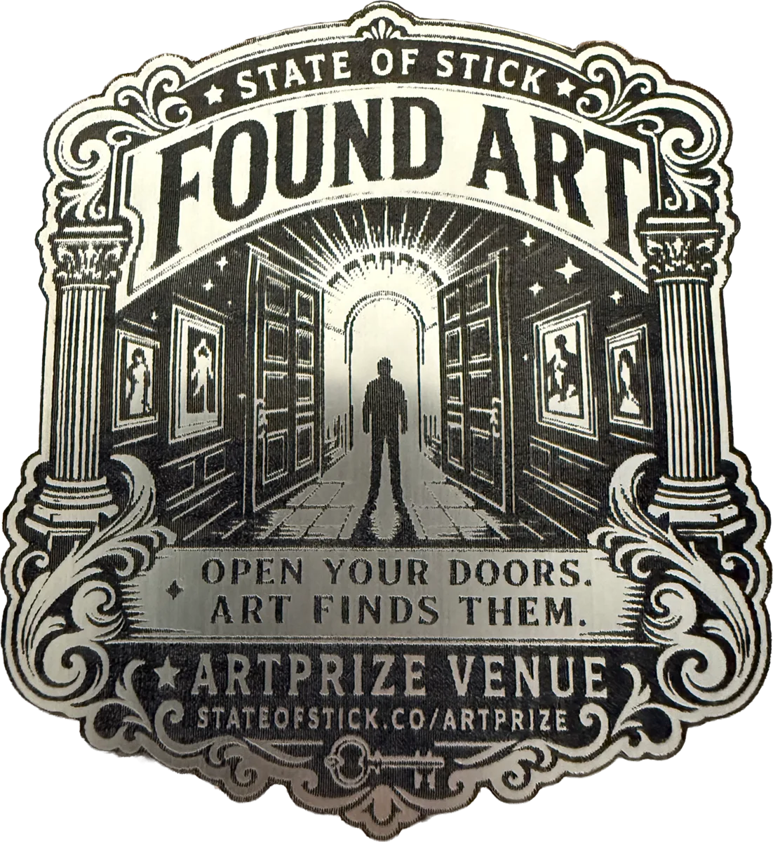 Ornate thin Found Art State of Stick emblem photographed on wood